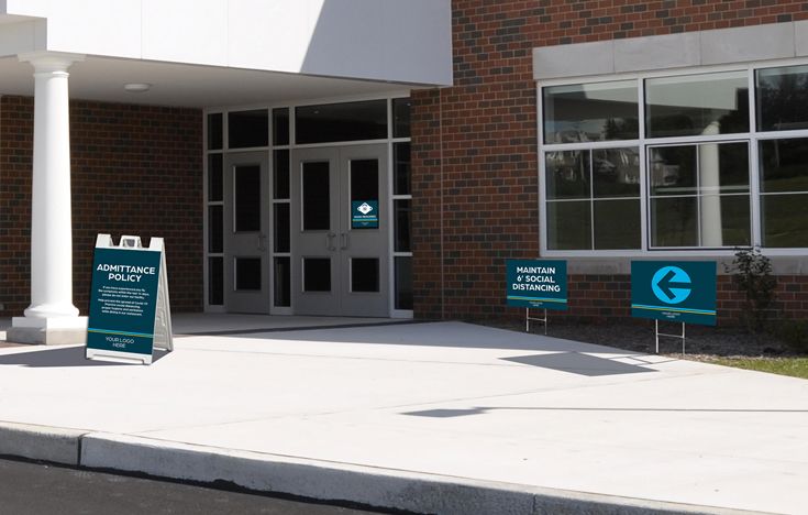 School Exterior with Reopening Signage